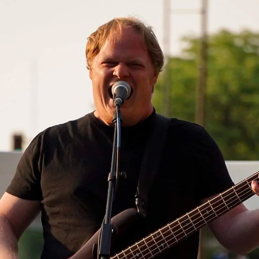 Sean playing bass and singing