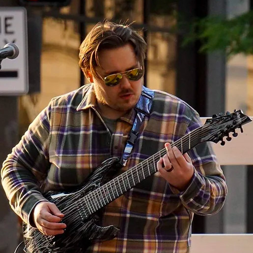 Tyler playing guitar
